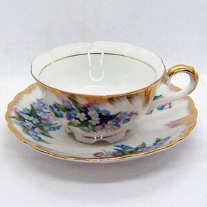 VTG Japanese teacup and saucer set, with a Forget-Me-Not floral pattern and gold